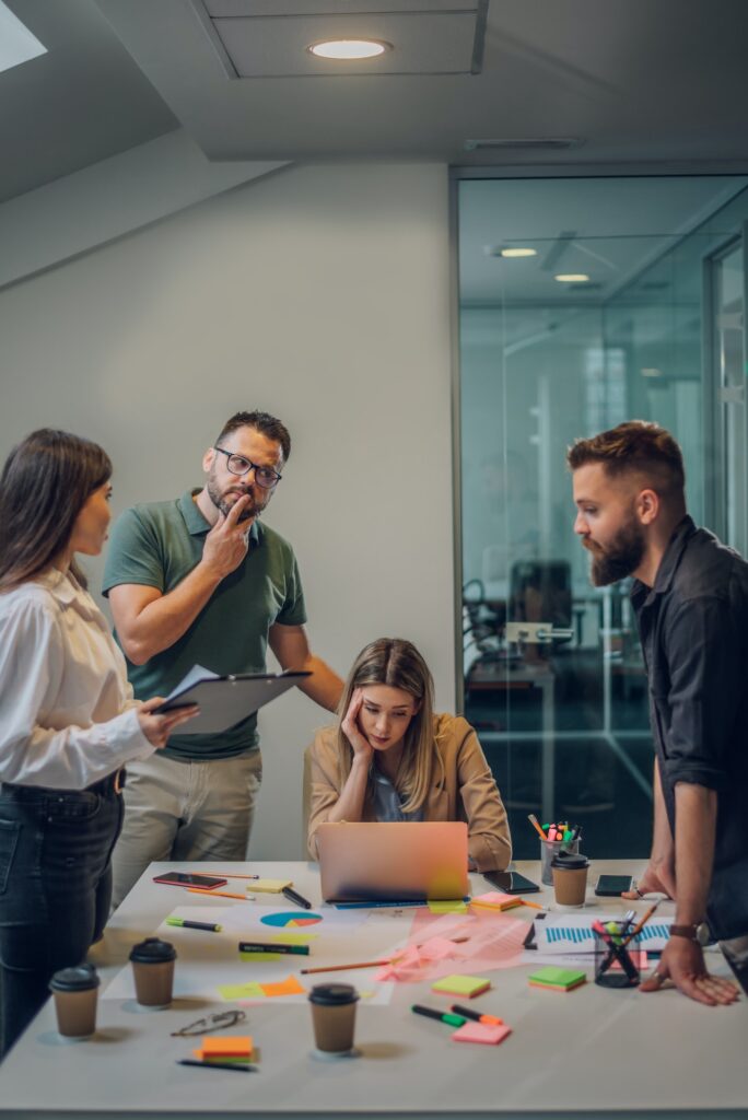 Stressed business colleagues having a meeting in an office and solving problems