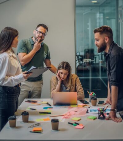 Stressed business colleagues having a meeting in an office and solving problems