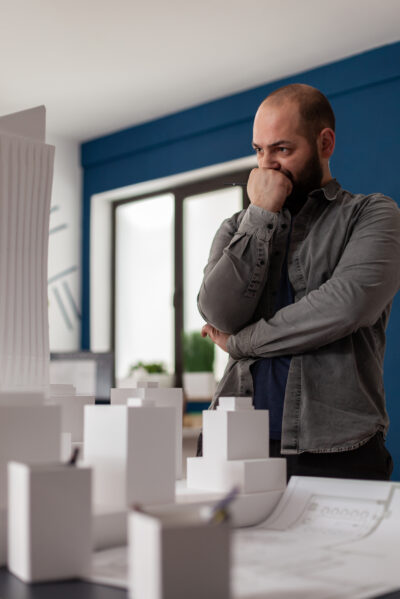 Architectural engineer thinking about design improvements